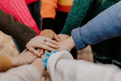 Women's hands on top of each other
